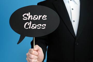 Share Class. Businessman holds speech bubble in his hand. Handwritten Word/Text on sign.