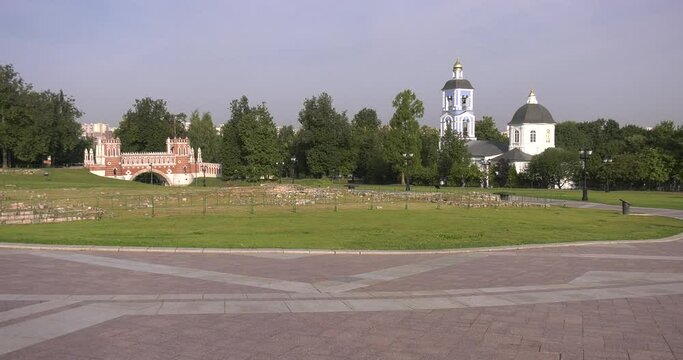 4K high quality sunny spring day video footage of famous Moscow Tsaritsyno Estate built during rein of Czarina Katherine 2 The Great with visitors and panorama of green park in the capital of Russia