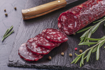 Dry-cured sausage with spices, garlic and herbs  .