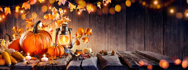 Thanksgiving - Old Table With Pumpkins And Corns With Bokeh Lights In Dark Background