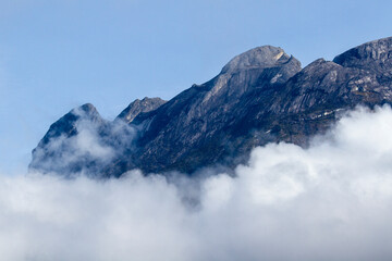 Mount Kinabalu jutting out above the cloud layer; Sabah Borneo