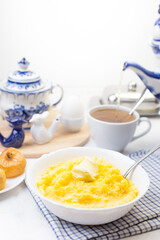 Delicious and healthy Breakfast with corn porridge and baked apples.