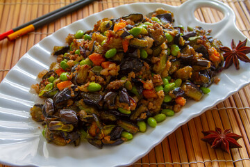 Stir fry eggplant with soybeans close up. Chinese food.