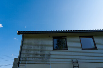 Cleaning the facade of the house.