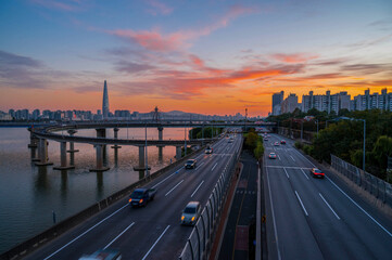  traffic at gwangnaru bridge   river bank during sunset  in seoul city south korea