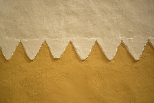 plaster wall in yellow tones