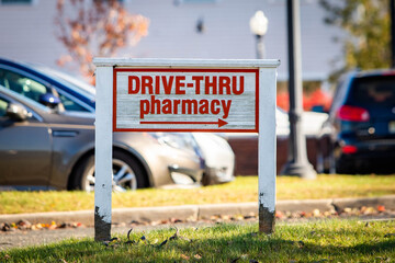 Drive-through pharmacy outdoor sign at sunny day