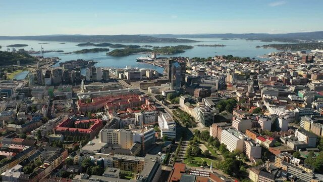 Oslo, Norway. Beautiful 4K panoramic aerial video from flying drone to Oslo city center. Against the background of the sea, mountains and blue sky on a sunny summer day. (Series)