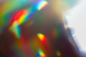 Colourful lens flare and haze on black background.