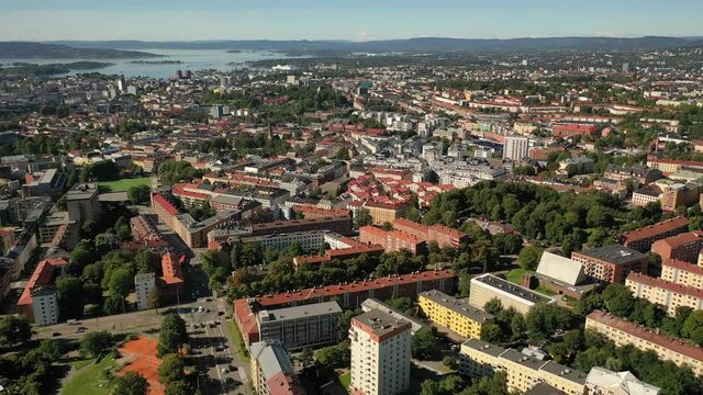 Oslo, Norway. Beautiful 4K panoramic aerial video from flying drone to Oslo city center. Against the background of the sea, mountains and blue sky on a sunny summer day. (Series)