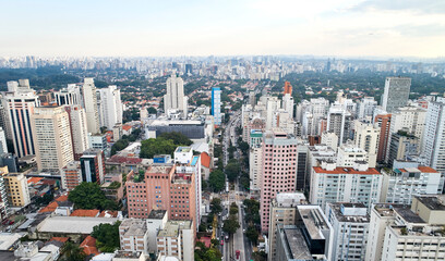Fototapeta na wymiar Aerial view of Nove de Julho avenue, commercial and residential buildings in the downtown in Sao Paulo city, Brazil.