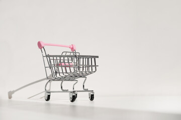Shopping cart isolated on white background. Safe online shopping on quarantine concept. Empty...