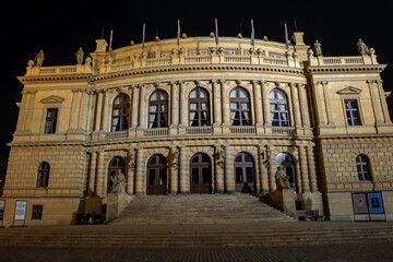 Fototapeta na wymiar illuminated neo-renaissance building Rudolfinum on the square in Prague exposed in 1885 and lights from street lighting at night in the Czech Republi