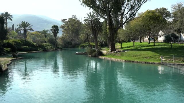 The river Amal flows through the kibbutz Nir David in the valley of Beit Shean. Israel. Nir David Country Lodge. 4K