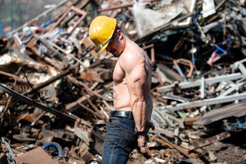 Man Showing His Body in Industrial Junk Yard