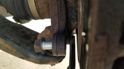 close up of a wheel and bolt