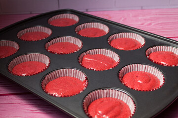 Red velvet cupcakes in a baking pan