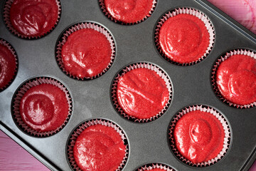 red belvet cupcakes in a baking pan close up