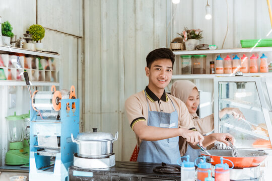 small business shop showing a muslim man and woman working in the kitchen