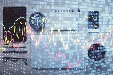Double exposure of forex graph hologram over desktop with phone. Top view. Mobile trade platform concept.