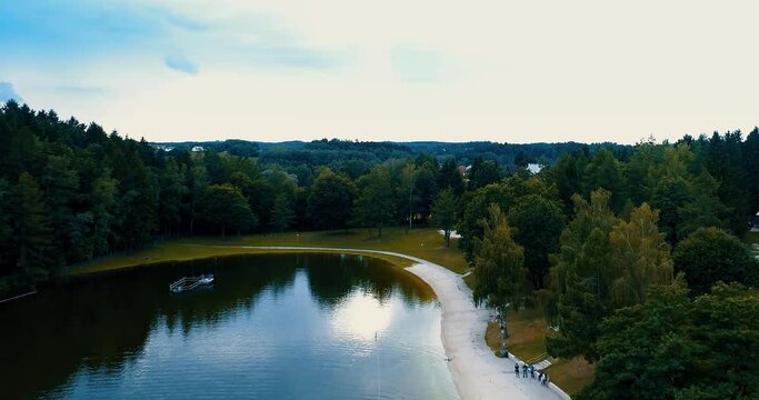 aerial view beautiful panorama of a lake surrounded by trees forest