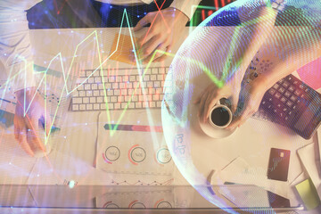 Double exposure of man and woman working together and financial chart hologram drawing. market analysis concept. Computer background. Top View.