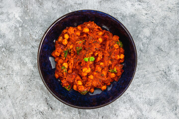 plant-based food, vegan moroccan chickpea stew with tomato sauce onion an carrots