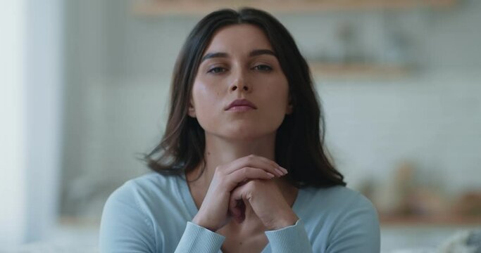 Close up portrait of frustrated young woman, getting focused, suffering from depression