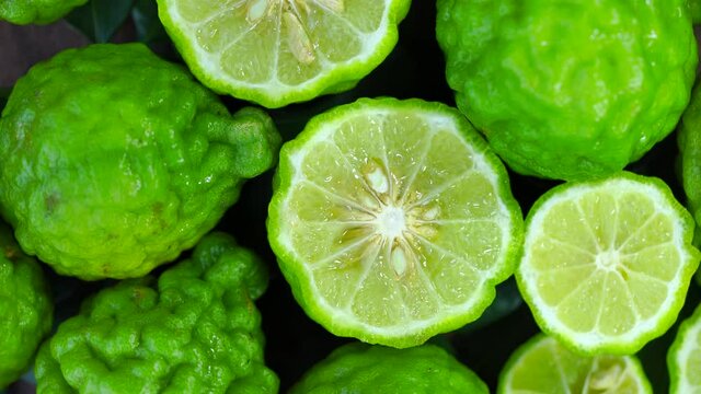 Top view Rotate of Transparent Slice of Bergamot fruit  on white background, Close up fresh Bergamot sliced on white background and slowly rotating.