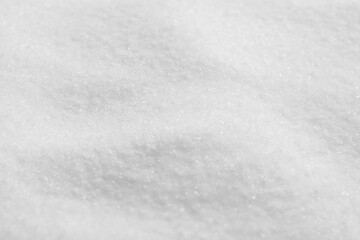 Natural white salt as background, closeup view