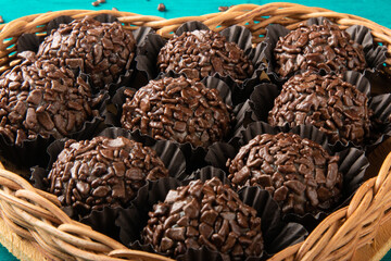 Brigadeiro.Traditional brazilian sweet chocolate in heart shaped basket.