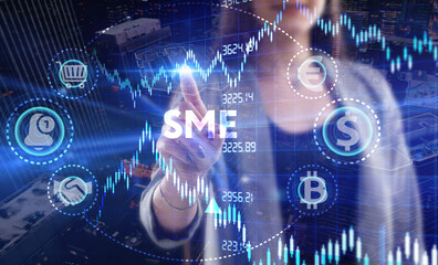 Business, Technology, Internet and network concept. Young businessman working on a virtual screen of the future and sees the inscription: SME