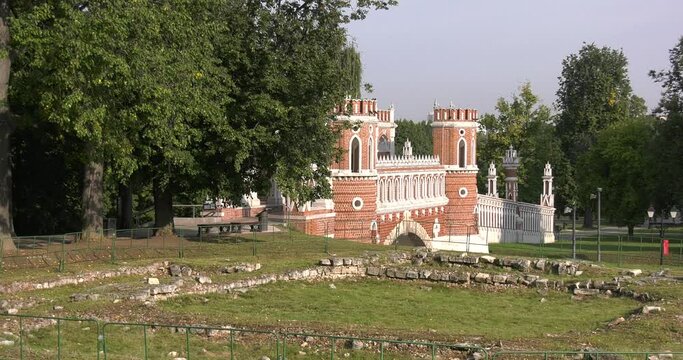 4K high quality sunny spring day video footage of famous Moscow Tsaritsyno Estate built during rein of Czarina Katherine 2 The Great with visitors and panorama of green park in the capital of Russia