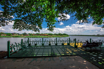 Background of religious tourist attractions in Ubon Ratchathani province of Thailand (Wat Su Phatthanaram Worawihan) contains old Buddhist temples and blessings for tourists to make merit on their way