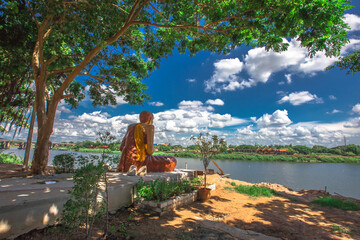 Background of religious tourist attractions in Ubon Ratchathani province of Thailand (Wat Su Phatthanaram Worawihan) contains old Buddhist temples and blessings for tourists to make merit on their way