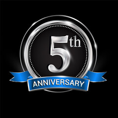 Celebrating 5th anniversary logo. with silver ring and blue ribbon.