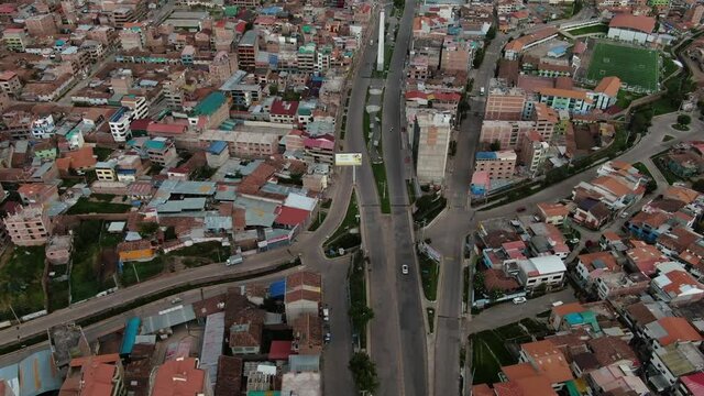 4k daytime aerial drone footage over Avenida de la Cultura boulevard in Cusco, Peru during Coronavirus lockdown. Dolly in and tilt down wide angle shot.