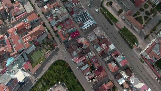 4K daytime before sunset aerial drone view in Cusco, Wanchaq and Rosaspata areas. Dolly in over Mariscal Gamarra and University stadium and Boom/Jib up over Rosaspata and San Blas. Wide angle shot