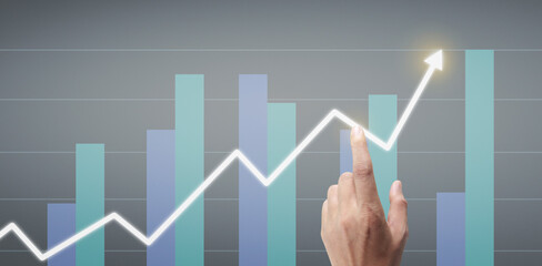 Hand touching a graphs of financial indicator  accounting market economy analysis chart