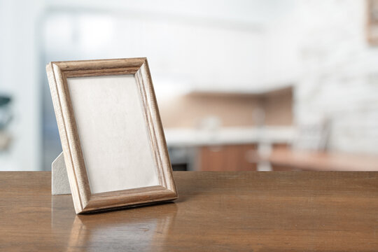 photo frame on the wooden table
