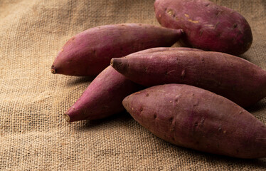 Sweet potatoes on the background of a hempenware