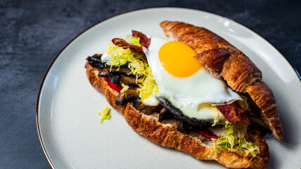 Portobello Croissant Breakfast Sandwich with sunny up egg