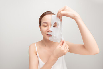 Spa, healthcare. Woman with purifying mask on her face isolated on white background.