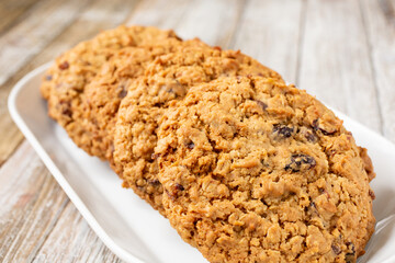 A view of a plate of oatmeal raisin cookies.