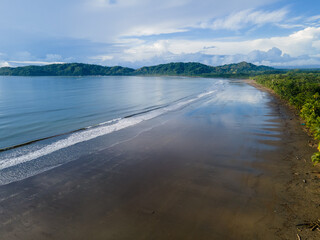 Aerial view of the beach with the reflection of the ocean