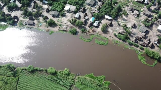 Village and farmland separated by a river near Nokoue village in Benin Africa