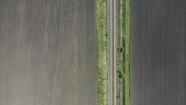 Drone fly over train track in hungary.