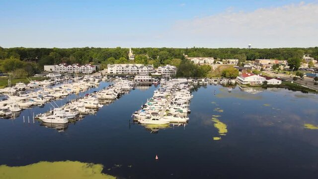 Drone flover of sailboats docked in a marina.