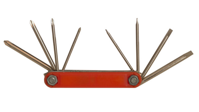 Multitool with a red plastic handle with one edge of which the opening rods of screwdrivers with a cross-shaped tip are fixed, with the other edge there are screwdrivers with a straight tip, isolated.