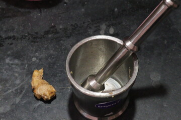 Motor and pestle isolated on black background